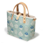 pale green floral print with blonde leather handles
