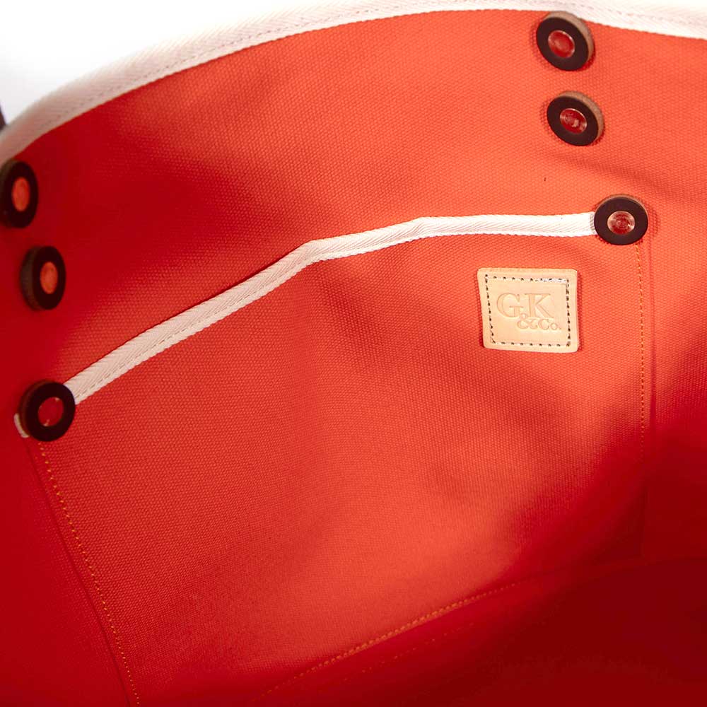 Interior Flame orange waxed canvas tote with brown leather handles