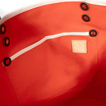 Interior Flame orange waxed canvas tote with brown leather handles