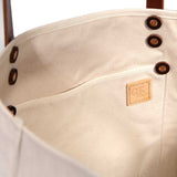 Interior Neutral off-white tote in natural canvas with brown leather straps