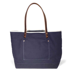 Navy waxed canvas tote with brown leather handles