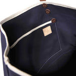 Interior Navy waxed canvas tote with brown leather handles