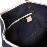 Interior Navy waxed canvas tote with brown leather handles