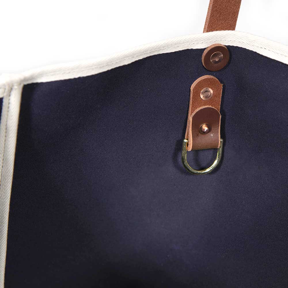 Interior Navy waxed canvas tote with brown leather handles