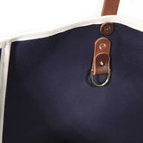 Interior Navy waxed canvas tote with brown leather handles