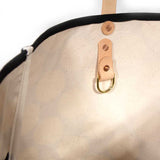 Interior Bold white and black oversized dot print tote with blonde leather handles and canvas trim
