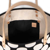 Interior Bold white and black oversized dot print tote with blonde leather handles and canvas trim