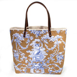 tote with oak and ink blue toile print with brown leather handles and natural canvas body