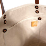 Interior tote oak and ink blue toile print with brown leather handles and natural canvas body