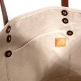 Interior tote oak and ink blue toile print with brown leather handles and natural canvas body