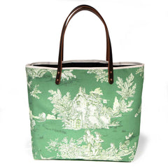 Emerald green toile print canvas tote with natural canvas top and brown leather handles