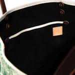 Interior Emerald green toile print canvas tote with natural canvas top and brown leather handles