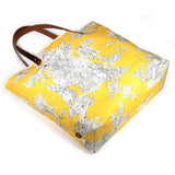 Yellow and black toile tote with brown leather handles