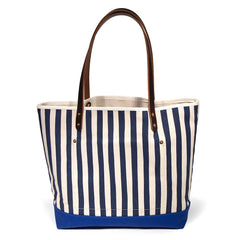 Navy and white stripe canvas tote with blue bottom and brown leather handles