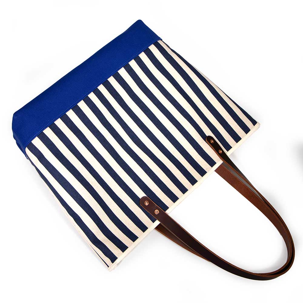 Navy and white stripe canvas tote with blue bottom and brown leather handles