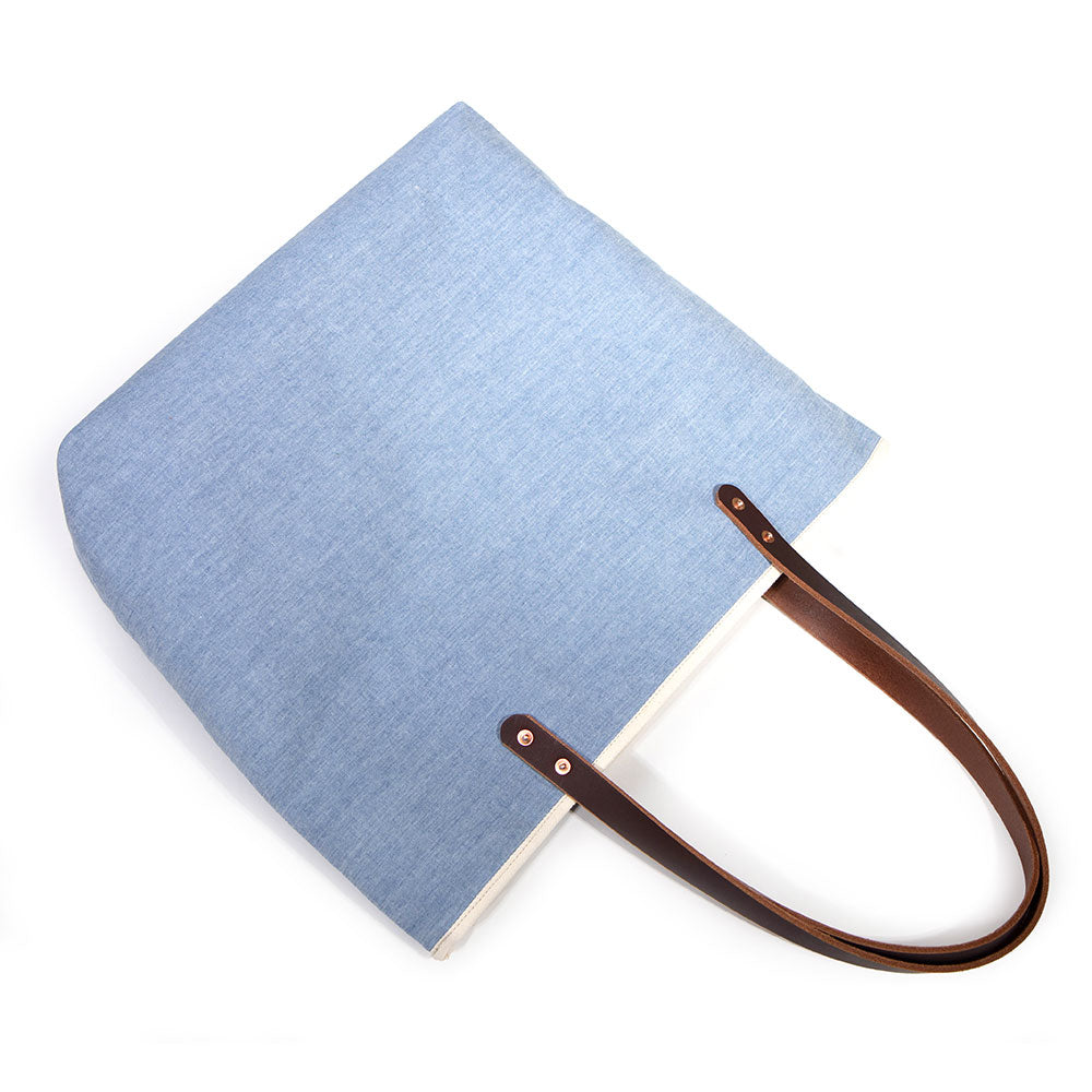 blue chambray tote bag with brown leather handles