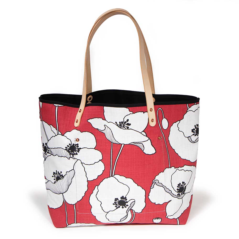 French Provençal-inspired canvas tote with red poppy print and blonde leather straps