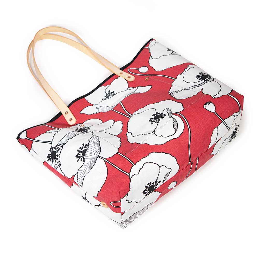 French Provençal-inspired canvas tote with red poppy print and blonde leather straps