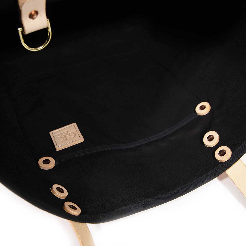 Interior French Provençal-inspired canvas tote with red poppy print and blonde leather straps