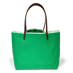 Bright kelly green canvas tote with natural leather handles
