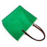 Bright kelly green canvas tote with natural leather handles
