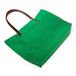 Bright kelly green canvas tote with natural leather handles