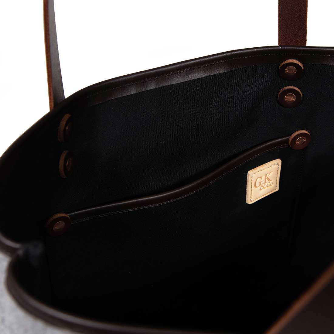 Interior gray wool flannel tote bag with brown leather handles