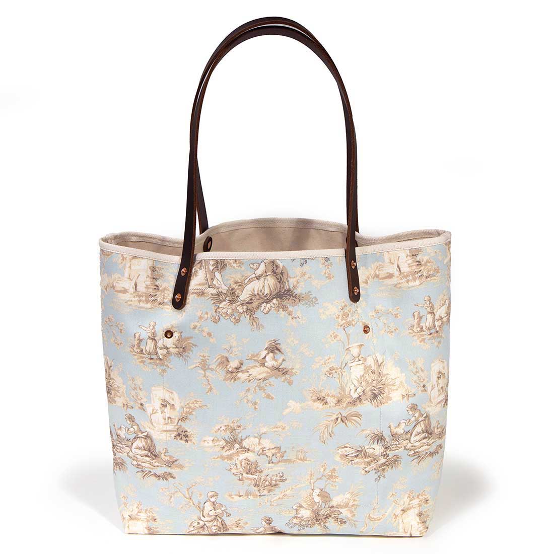 pale blue toile fabric tote bag with dark mahogany leather handles