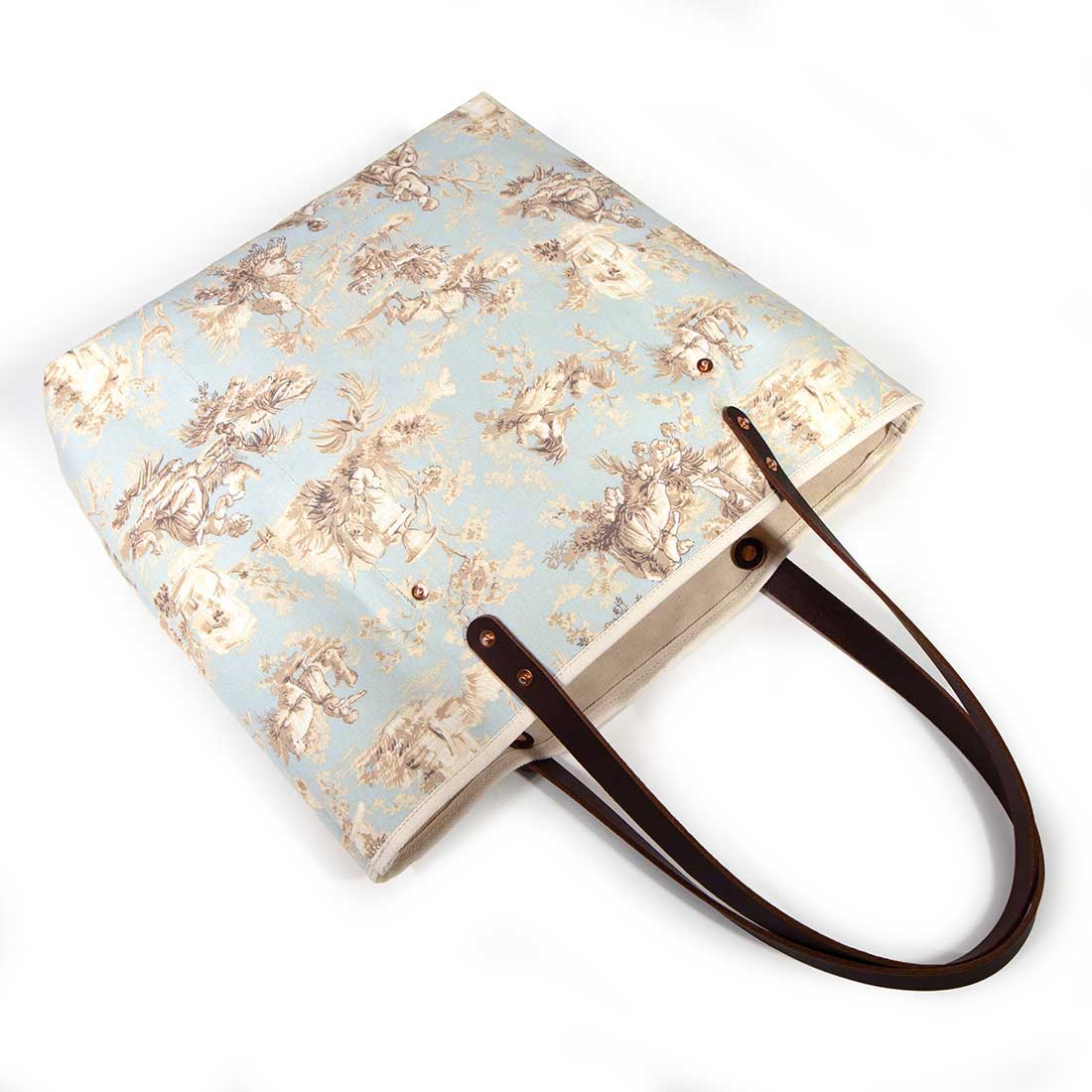 pale blue toile fabric tote bag with dark mahogany leather handles