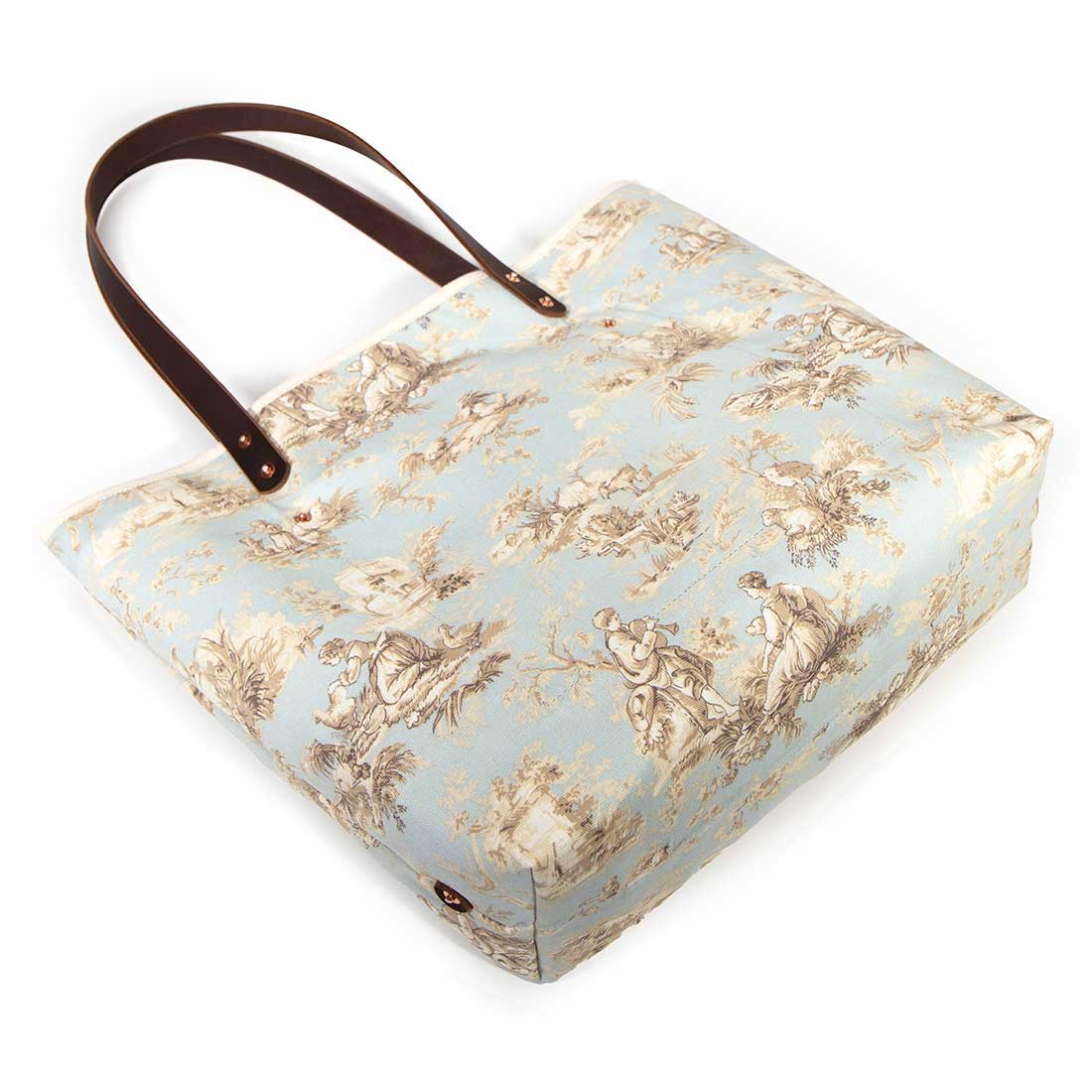 pale blue toile fabric tote bag with dark mahogany leather handles