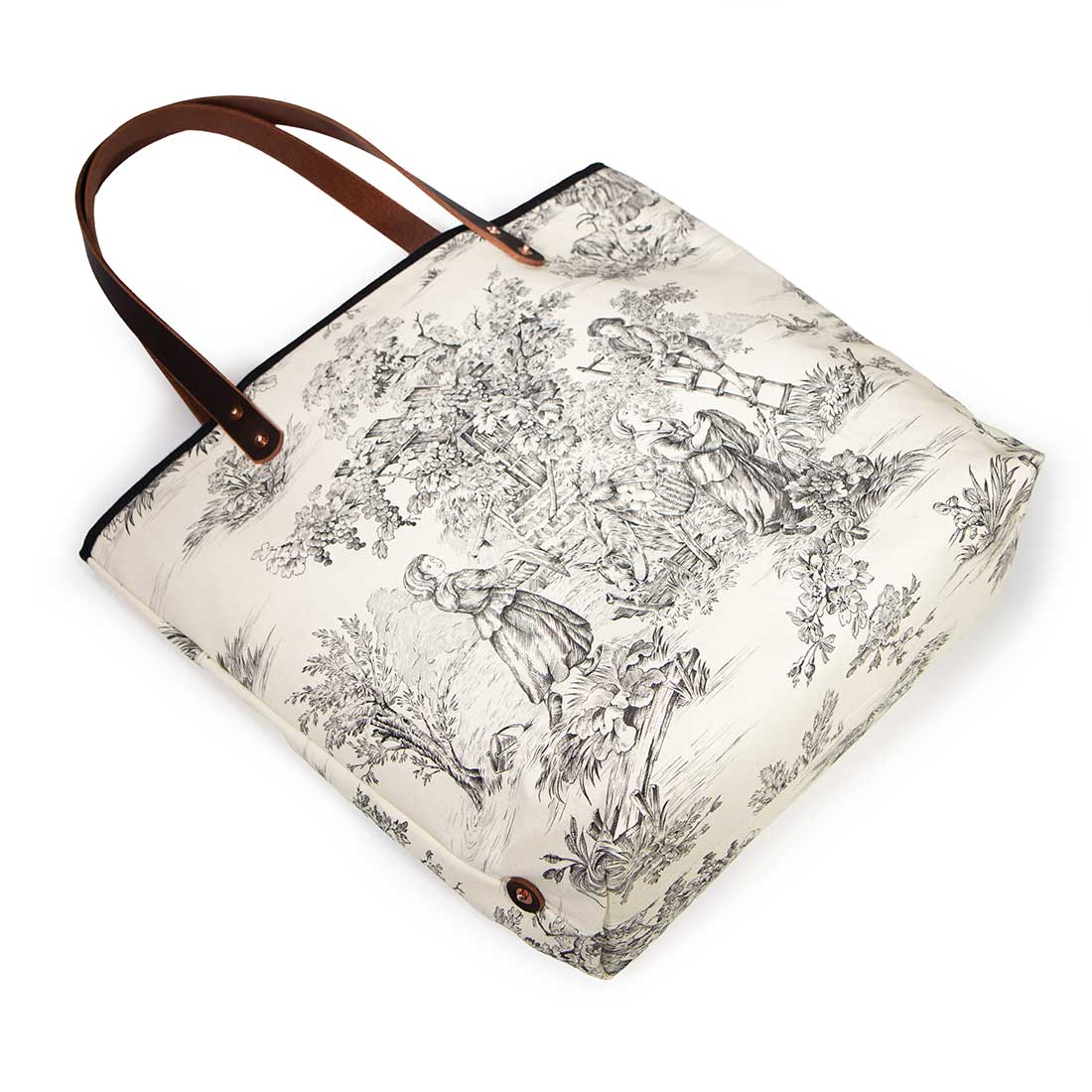 French country black and white toile print tote with soft leather handles and water-resistant lining