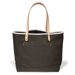 Olive green waxed canvas tote with blonde leather straps and durable stitching