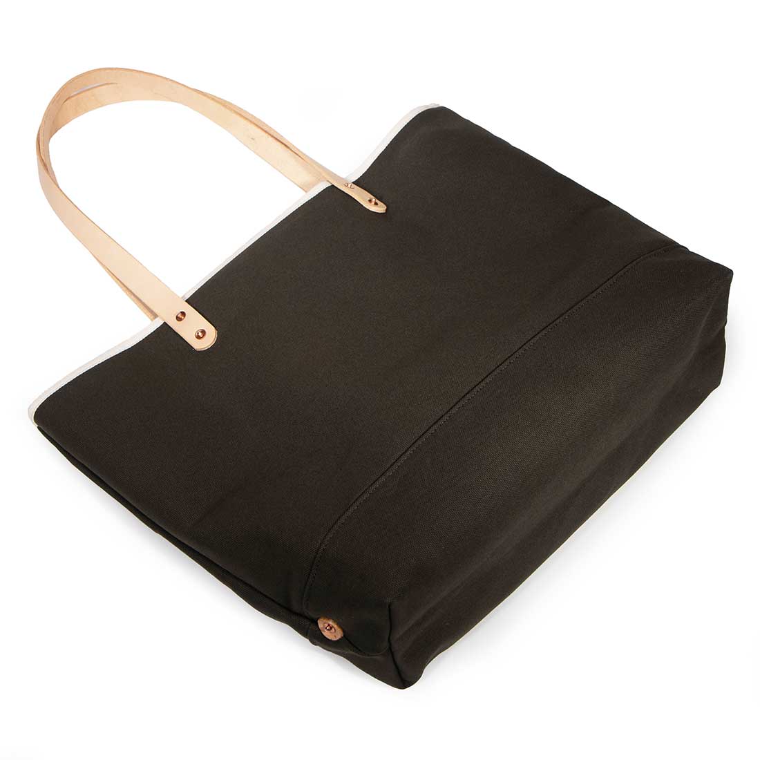 Olive green waxed canvas tote with blonde leather straps and durable stitching