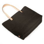 Olive green waxed canvas tote with blonde leather straps and durable stitching