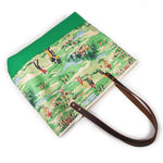 Colorful golf course print tote with leather handles and canvas trim