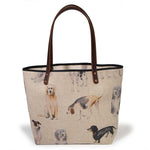 Dog Park All Day Tote in natural linen with a watercolor dog print, shown from the front with mahogany leather handles