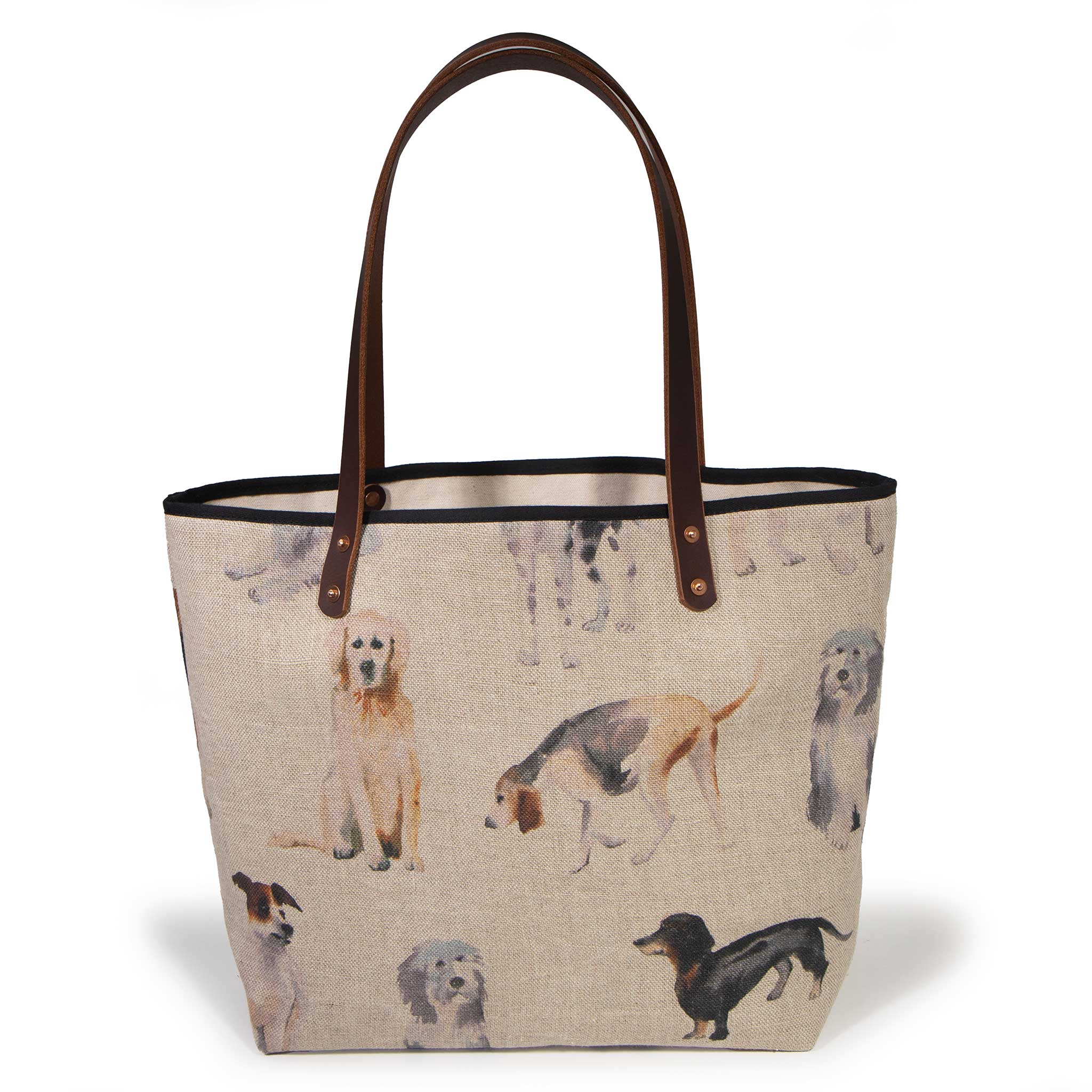 Dog Park All Day Tote in natural linen with a watercolor dog print, shown from the front with mahogany leather handles