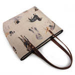 Dog Park All Day Tote from above, leather handles laid across the opening