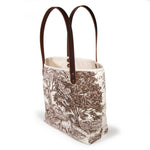 Country Horse All Day Tote at an angle, showing the cream canvas top binding and riveted handles