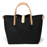black waxed canvas mini tote with blonde leather handles
