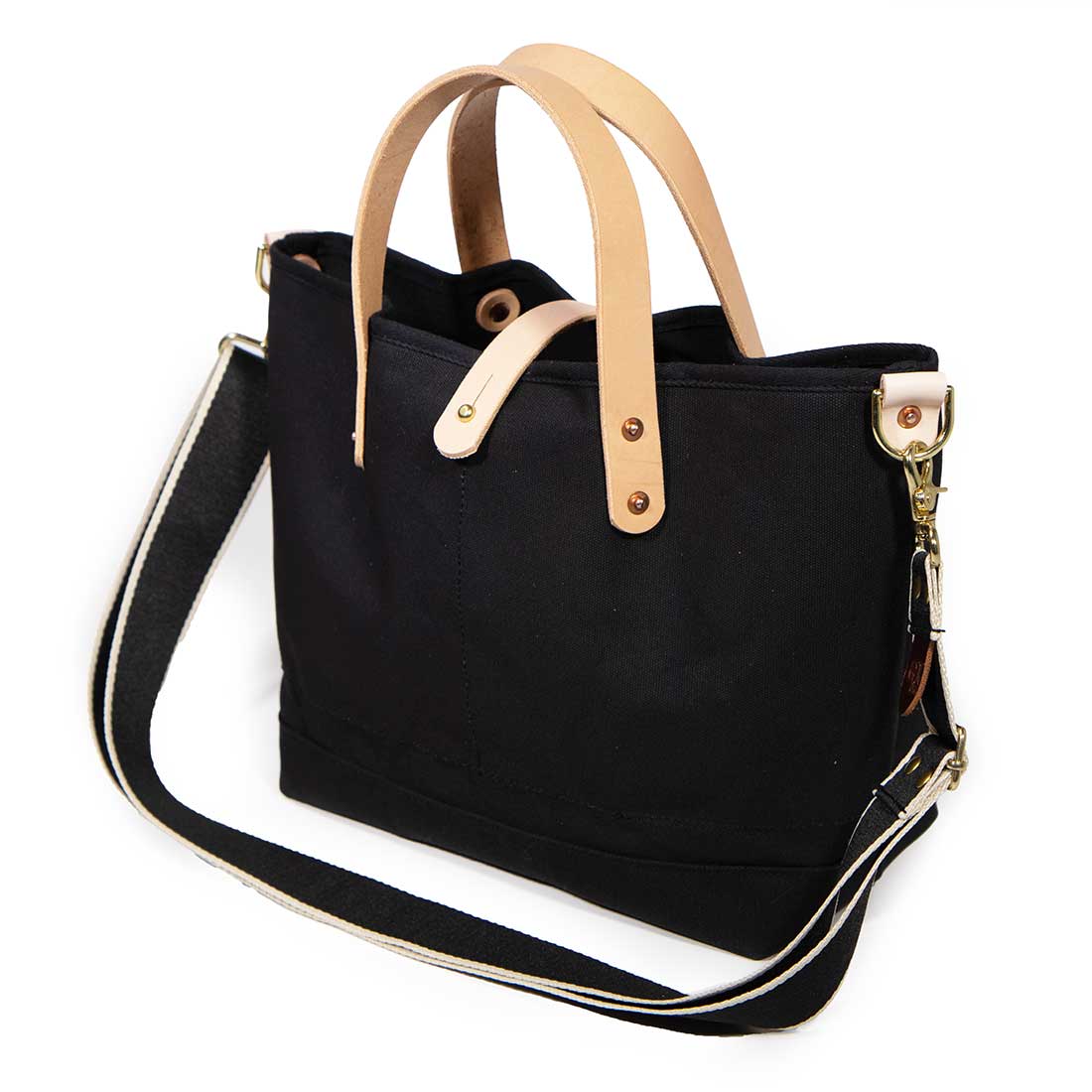 shoulder strap black waxed canvas mini tote with blonde leather handles