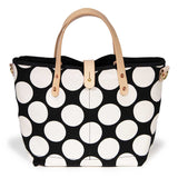 Bold black and white oversized dot print tote with blonde leather handles