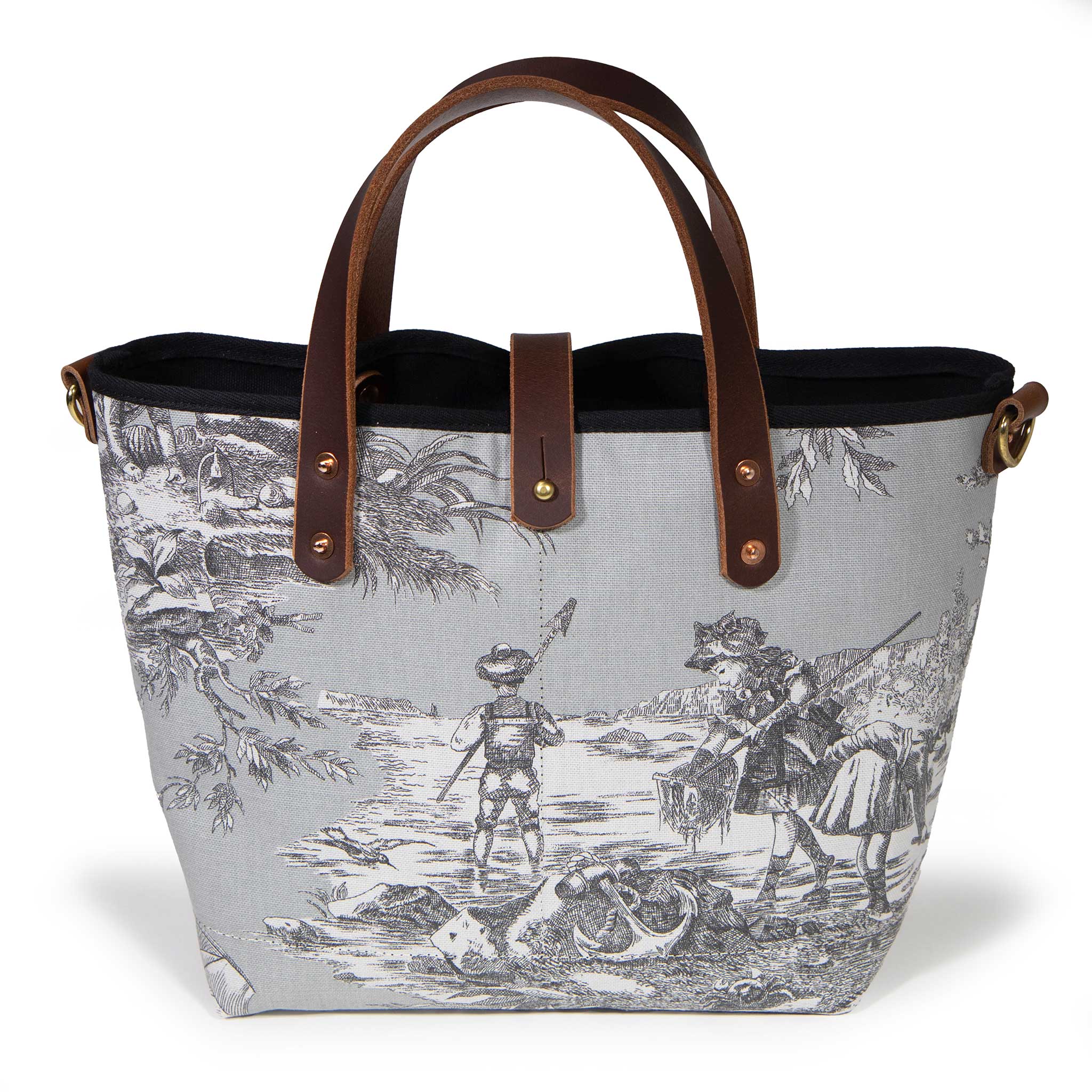 Front of the fog grey Seaside Toile Mini Tote, children wading with nets along the shore, with mahogany handles and button tab
