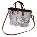 Fog grey Seaside Toile Mini Tote worn with a mahogany leather crossbody strap