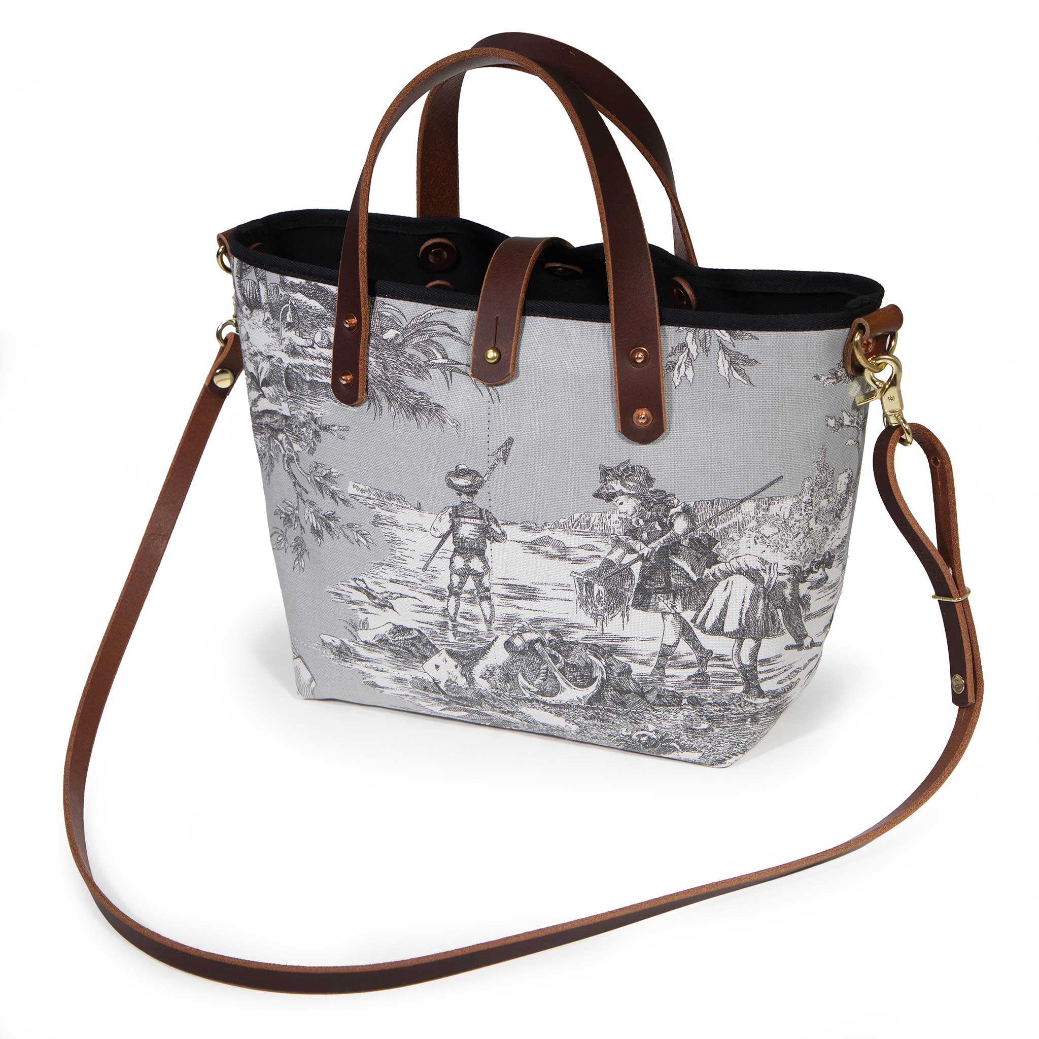 Fog grey Seaside Toile Mini Tote worn with a mahogany leather crossbody strap