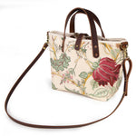 Botanique Floral Print Mini Tote worn with a mahogany leather crossbody strap