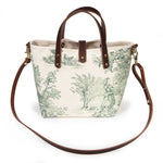 Butter and Pine Toile Mini Tote worn with a mahogany leather crossbody strap