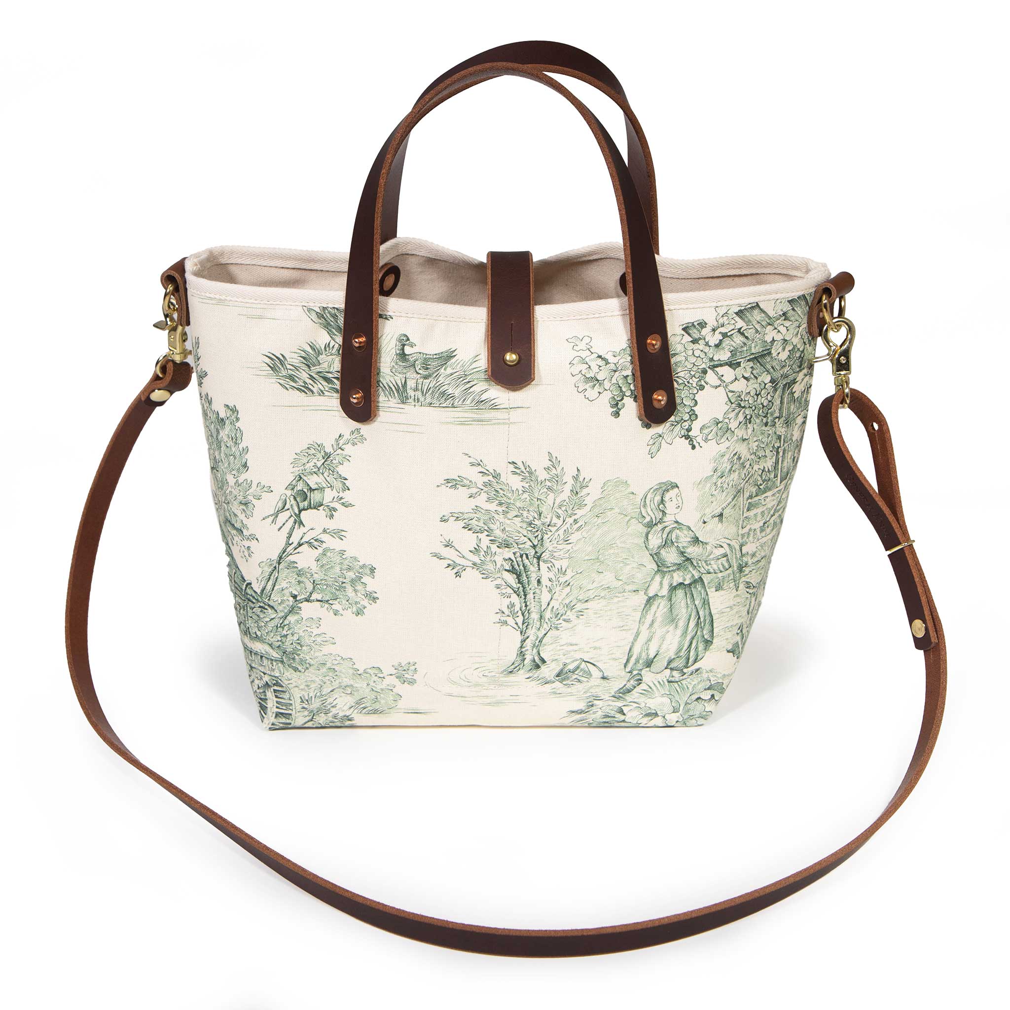 Butter and Pine Toile Mini Tote worn with a mahogany leather crossbody strap
