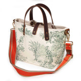 Butter and Pine Toile Mini Tote with an orange and tan striped crossbody strap
