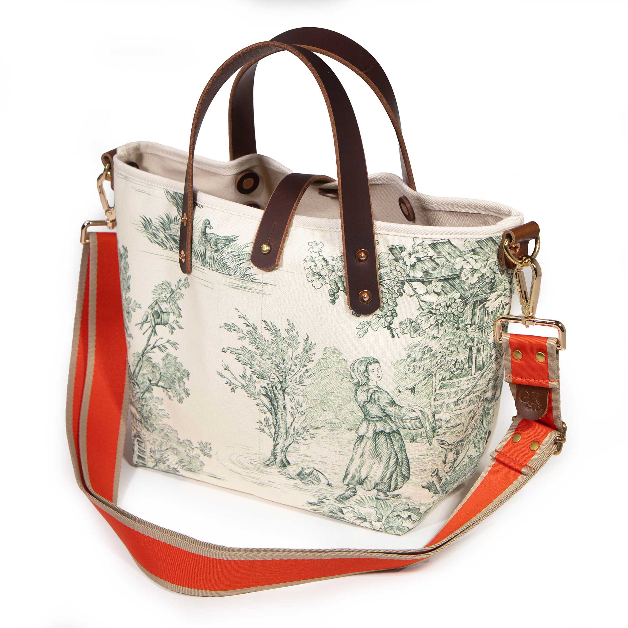 Butter and Pine Toile Mini Tote with an orange and tan striped crossbody strap